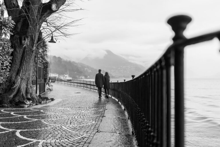 romantic couple walking overlooking the lake
